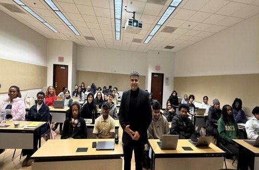 Hemant Soni standing with a full class of CIS students at Georgia State University